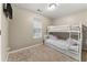 bedroom with a bunk bed and plenty of natural light at 3361 Highway 3 N, Hampton, GA 30228