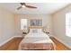 Spacious bedroom with hardwood floors, ceiling fan, and neutral decor at 2191 Essex Sw Ave, Atlanta, GA 30311