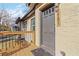 Gray front door and a wooden deck at the entrance of the home at 2191 Essex Sw Ave, Atlanta, GA 30311