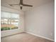 Bright bedroom with large window and ceiling fan at 1291 Low Water Way, Lawrenceville, GA 30045