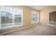 Spacious bedroom with neutral carpeting and large windows at 1291 Low Water Way, Lawrenceville, GA 30045