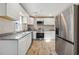 Modern kitchen with white cabinets, granite counters, and stainless steel appliances at 1591 Athens Sw Ave, Atlanta, GA 30310