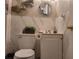 Small bathroom with marble tile, decorative mirror, and updated vanity at 1625 Conley Rd # 229, Conley, GA 30288