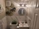 Updated half bathroom with marble tile and decorative accents at 1625 Conley Rd # 229, Conley, GA 30288