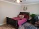 Bedroom with a queen-size bed and a sunburst mirror at 1625 Conley Rd # 229, Conley, GA 30288