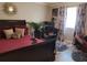 Bedroom with a queen-size bed, home office space, and window at 1625 Conley Rd # 229, Conley, GA 30288