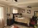 Well-lit bedroom with a king-size bed and decorative mirrors at 1625 Conley Rd # 229, Conley, GA 30288