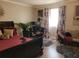 Spacious bedroom with a large bed, home office area, and plenty of natural light at 1625 Conley Rd # 229, Conley, GA 30288