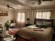 Bright bedroom with a king-size bed, sitting area, and large windows at 1625 Conley Rd # 229, Conley, GA 30288