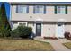 Two-story townhome with neutral siding, landscaping, and two front doors at 1625 Conley Rd # 229, Conley, GA 30288