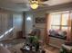 Bright living room with hardwood floors, window seat and a ceiling fan at 1625 Conley Rd # 229, Conley, GA 30288