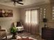 Cozy sitting area with two armchairs and a large window at 1625 Conley Rd # 229, Conley, GA 30288