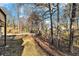 Landscaped backyard with mature trees and deck at 2702 Norma Cir, Decatur, GA 30034
