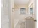 Updated bathroom features granite vanity, tiled floors, and a bathtub at 2702 Norma Cir, Decatur, GA 30034