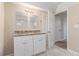 Double vanity bathroom with granite countertops and tiled floors at 2702 Norma Cir, Decatur, GA 30034