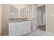Double vanity bathroom with granite countertop and tiled floors at 2702 Norma Cir, Decatur, GA 30034