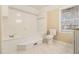 Clean bathroom with soaking tub, toilet and tiled floors at 2702 Norma Cir, Decatur, GA 30034