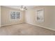 Well-lit bedroom with neutral carpeting and multiple windows at 2702 Norma Cir, Decatur, GA 30034