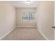 Bedroom with neutral walls, carpet flooring, and a window at 2702 Norma Cir, Decatur, GA 30034