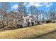 Side view of the house showcasing the gray brick exterior and backyard at 2702 Norma Cir, Decatur, GA 30034