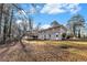 Gray house with deck and large backyard, surrounded by trees at 2702 Norma Cir, Decatur, GA 30034