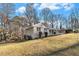 Gray house with a large grassy yard and mature trees at 2702 Norma Cir, Decatur, GA 30034