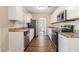 Kitchen with white cabinets, granite countertops, and stainless steel appliances at 2702 Norma Cir, Decatur, GA 30034