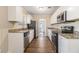 Modern kitchen with white cabinets and granite counters at 2702 Norma Cir, Decatur, GA 30034