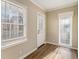 Bright sunroom with hardwood floors and white door at 2702 Norma Cir, Decatur, GA 30034