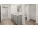 Double vanity bathroom with a toilet and linen closet at 145 Bonito Trl, Covington, GA 30016