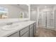 Bathroom boasts double sinks, a shower, and modern vanity at 145 Bonito Trl, Covington, GA 30016