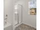 Bathroom with shower, tub, and window at 145 Bonito Trl, Covington, GA 30016