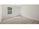 Bright bedroom with a window and carpet at 145 Bonito Trl, Covington, GA 30016