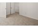 Spacious bedroom with carpet and door at 145 Bonito Trl, Covington, GA 30016