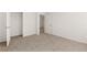 Spacious bedroom with neutral carpet and closet at 145 Bonito Trl, Covington, GA 30016