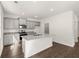 Modern kitchen featuring granite island and gray cabinetry at 145 Bonito Trl, Covington, GA 30016