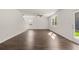 Open living room with hardwood floors and access to backyard at 145 Bonito Trl, Covington, GA 30016