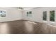 Open living space with hardwood floors and access to patio at 145 Bonito Trl, Covington, GA 30016