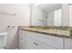 Updated bathroom with granite countertop and white vanity at 2307 Cresta Dr, Decatur, GA 30032