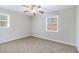 Spacious bedroom with neutral carpeting and large window at 2307 Cresta Dr, Decatur, GA 30032