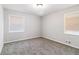 Well-lit bedroom featuring neutral walls and carpeting at 2307 Cresta Dr, Decatur, GA 30032
