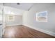 Bright bedroom with hardwood floors and neutral walls at 2307 Cresta Dr, Decatur, GA 30032