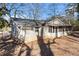 Charming ranch house with a screened porch and mature trees at 2307 Cresta Dr, Decatur, GA 30032