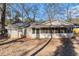 Front view of the charming ranch house with a screened porch at 2307 Cresta Dr, Decatur, GA 30032