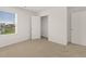Well-lit bedroom with window and closet at 120 Bonito Trl, Covington, GA 30016