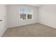 Spacious bedroom with window and carpet at 120 Bonito Trl, Covington, GA 30016