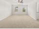 Spacious bedroom with carpet flooring and ceiling fan at 120 Bonito Trl, Covington, GA 30016