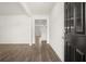 Bright entryway with dark door and hardwood floors at 120 Bonito Trl, Covington, GA 30016