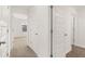 Bright hallway with neutral walls and carpet at 120 Bonito Trl, Covington, GA 30016