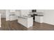 Modern kitchen with island, granite countertops and hardwood floors at 120 Bonito Trl, Covington, GA 30016